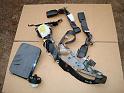 Gas_tank_cover_and_seat_belt_tensioner