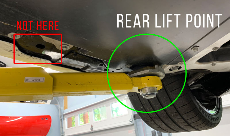 The correct REAR lifting points for the C8 Corvette are located just in front of the rear wheels.